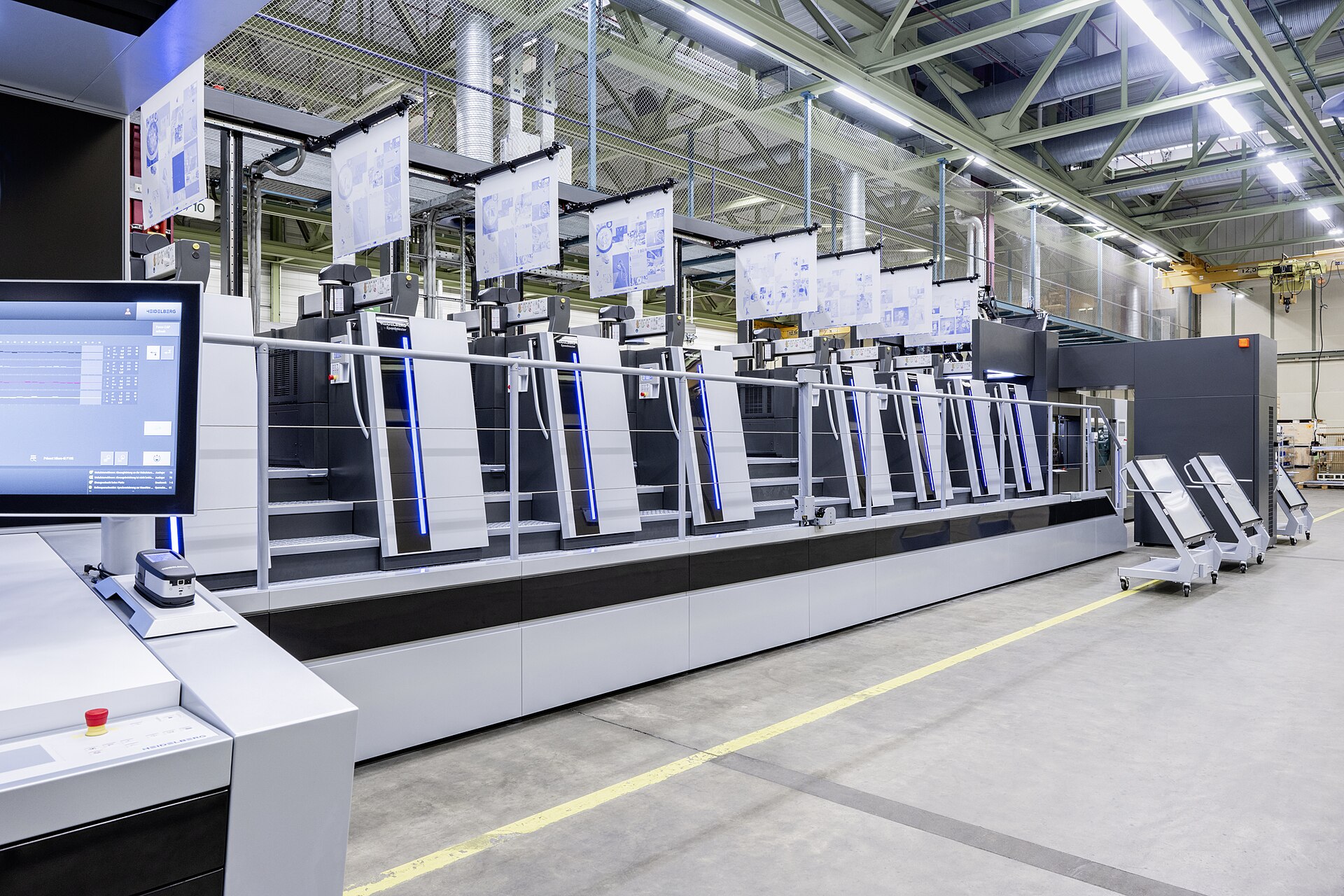 A six-unit Heidelberg Speedmaster sheet-fed offset press on a print-shop floor